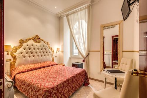 Un pat sau paturi într-o cameră la Hotel Virginia