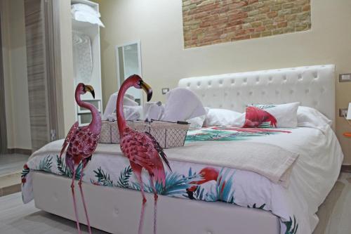 Кровать или кровати в номере Flamingo Luxury Apartment