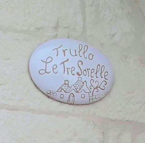 a sign that says truth be free service on a wall at Trullo Le Tre Sorelle in Cisternino