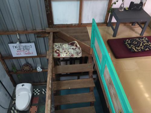 an overhead view of a bathroom with a toilet in a room at Yez Yez Yez All Good Hostel in Yogyakarta