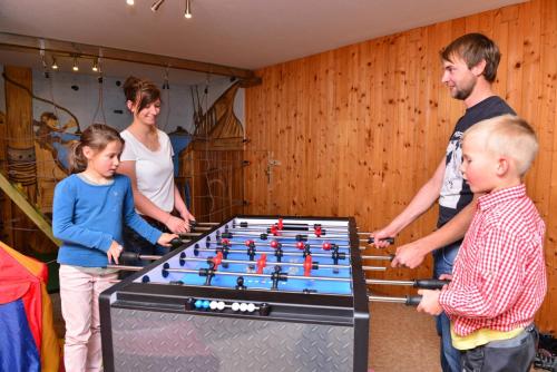 a group of people standing around a table with at Familienhotel Löwen in Nesselwang