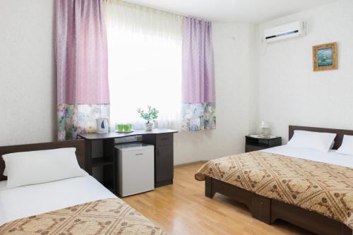 En eller flere senger på et rom på Bukhta №5 Guest House
