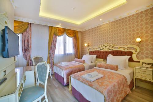 Cama o camas de una habitación en Nayla Palace Hotel-Special Category
