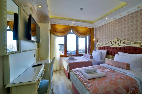Cama o camas de una habitación en Nayla Palace Hotel-Special Category