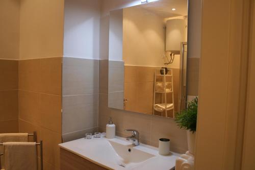 a bathroom with a sink and a mirror at Casa Palladio in Vicenza