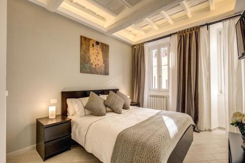 Postel nebo postele na pokoji v ubytování Dimore Costaguti