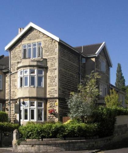 a large brick house with white windows at The Bath House Boutique B&B - IN-ROOM Breakfast - FREE parking in Bath