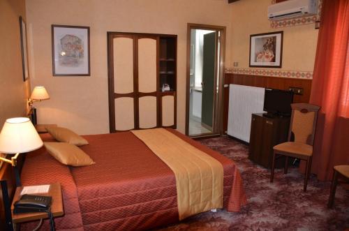 מיטה או מיטות בחדר ב-Hotel Milano