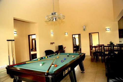 a living room with a pool table in a room at Lake View Hotel & Bungalow(pvt) Ltd in Nuwara Eliya