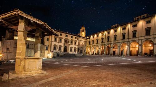 a large building with a court yard at night at BioBenessere Eco-B&B -Adults Only- Moto&Bike Parking in Arezzo