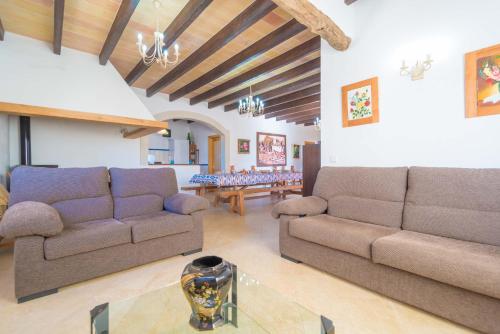 a living room with two couches and a table at Son Pujol in Montuiri