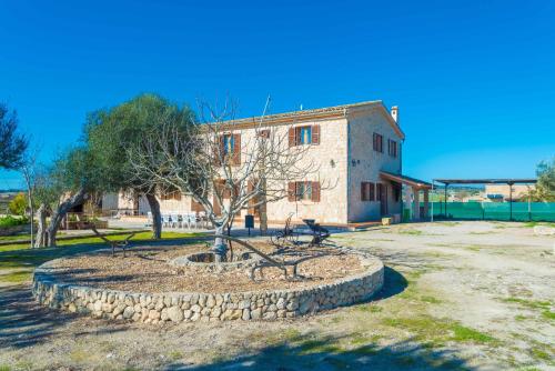 a building with a tree in front of it at Son Pujol in Montuiri