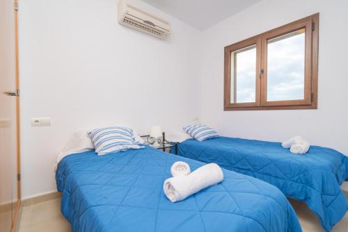 Postel nebo postele na pokoji v ubytování Marina D'Or IV Casa 5