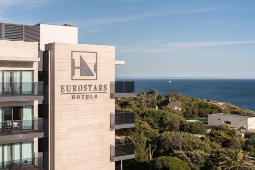 a hotel with a sign on the side of a building at Eurostars Cascais in Cascais