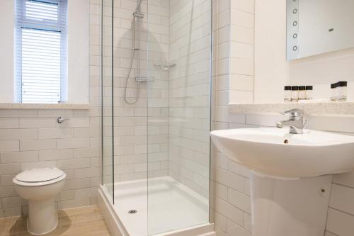 a bathroom with a sink and a toilet and a shower at Toby Carvery Doncaster by Innkeeper's Collection in Doncaster