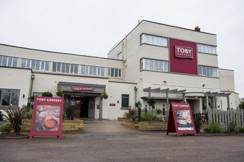 a large white building with two signs in front of it at Toby Carvery Doncaster by Innkeeper's Collection in Doncaster