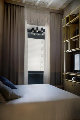a bedroom with a large bed and a window at Benci House in Florence