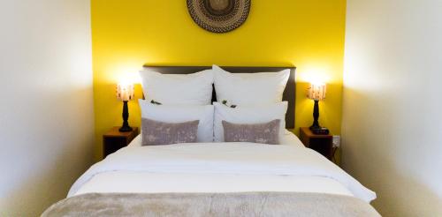 מיטה או מיטות בחדר ב-Kapensis Guesthouse (Pty) Ltd