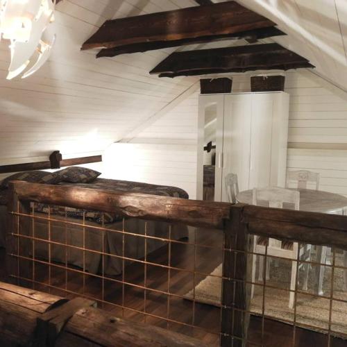 a room with two beds and a table at Bjärkeryd Södergård Bed & Stable in Kisa