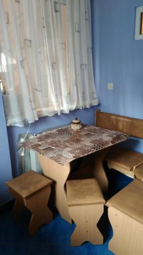 a table in a room with a table and chairs at Turul in Berehove