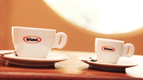 two cups of coffee sitting on a table at Idelson Hotel in Tel Aviv