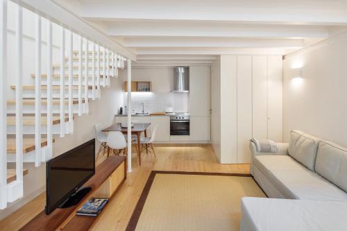 a living room with a couch and a table at Glory Days Lisbon Apartments in Lisbon