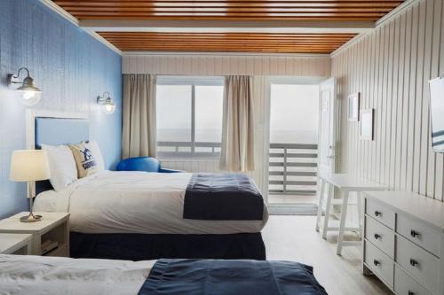 Motel La Marina tesisinde bir odada yatak veya yataklar