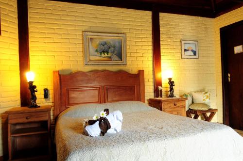 Cama o camas de una habitación en Hotel da Cachoeira
