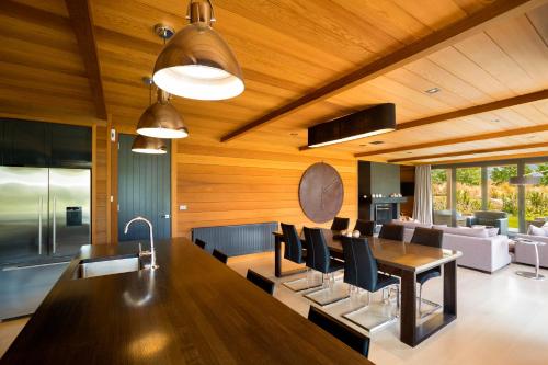 a kitchen and dining room with a table and chairs at Millbrook Resort in Arrowtown
