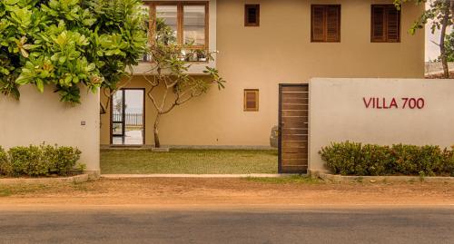 a building with a sign that reads villa at Jetwing Villa 700 in Bentota