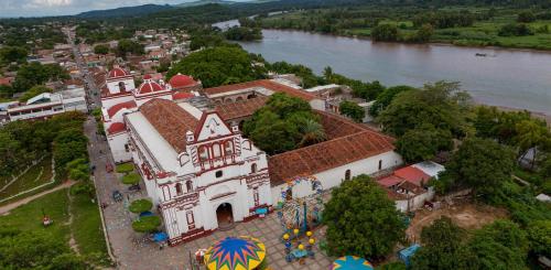 an aerial view of a church next to a river at Hotel De Santiago in Chiapa de Corzo