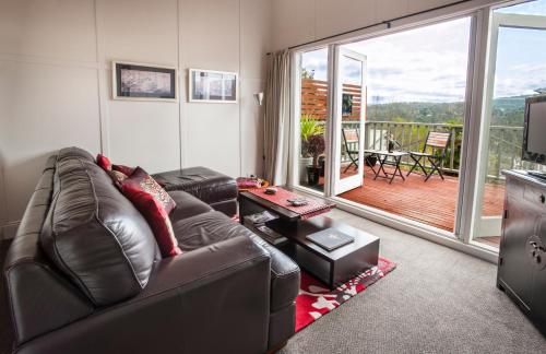 a living room filled with furniture and a window at Healesville Apartments in Healesville