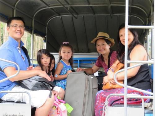 a group of people sitting on a bus at Manora Garden in Phangnga