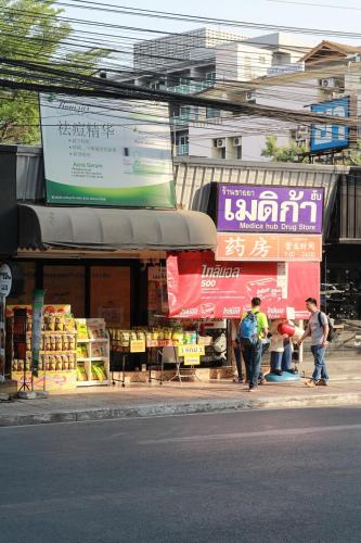 a group of people standing in front of a market at Chill Chill at Nimman in Chiang Mai