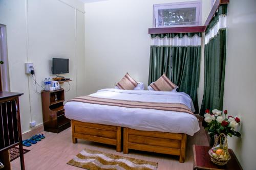 Postel nebo postele na pokoji v ubytování Niraamaya Retreats Aradura Kohima