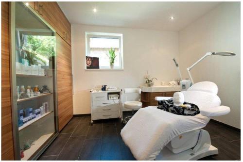 a hospital room with a bed and a sink at Appartements Hartlbauer in Dorfgastein