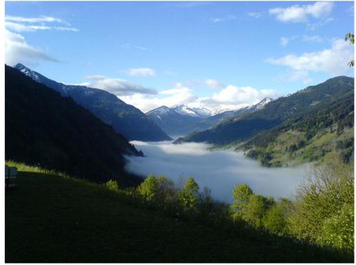 a view of a lake in a valley with mountains at Appartements Hartlbauer in Dorfgastein