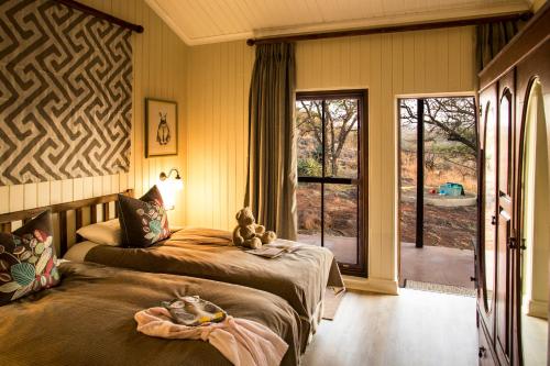 Säng eller sängar i ett rum på Three Tree Hill Lodge