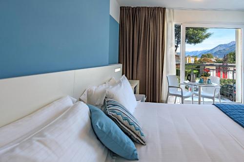 Postel nebo postele na pokoji v ubytování Hotel Vischi