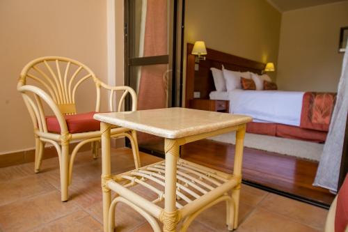 Ένα ή περισσότερα κρεβάτια σε δωμάτιο στο Waridi Paradise Hotel and Suites
