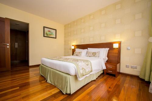 Ένα ή περισσότερα κρεβάτια σε δωμάτιο στο Waridi Paradise Hotel and Suites