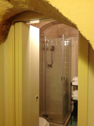 a bathroom with a shower with a glass door at A Casa di Irene in Matera