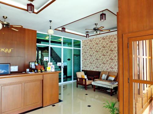 a lobby with a waiting area and a waiting room at Karnmanee Place in Udon Thani