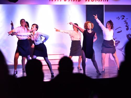 a group of people dancing on a stage at TH Pila in Pila