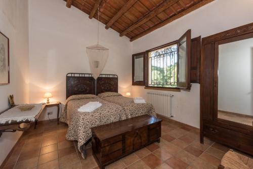 A bed or beds in a room at Azienda Agrituristica Tenuta Pizzolungo