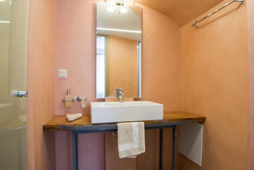 a bathroom with a sink and a mirror at Pantanassa Villa Thalia in Agia Marina Nea Kydonias