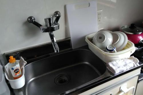 Kuchyň nebo kuchyňský kout v ubytování Guesthouse Imari Honjin