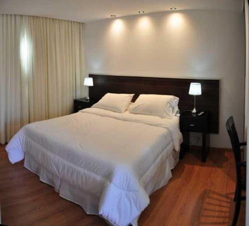 Katil atau katil-katil dalam bilik di Hotel L' Hirondelle