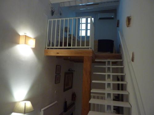 a staircase in a room with a stair case at Casita Blanca in Graus