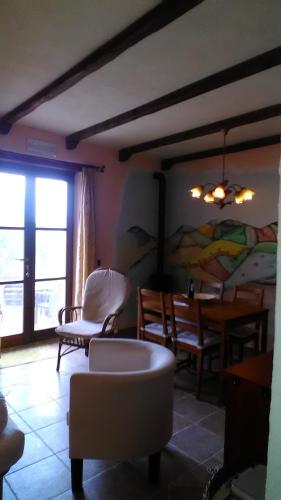 a living room with a couch and chairs and a table at Agriturismo Carincone in Pergola